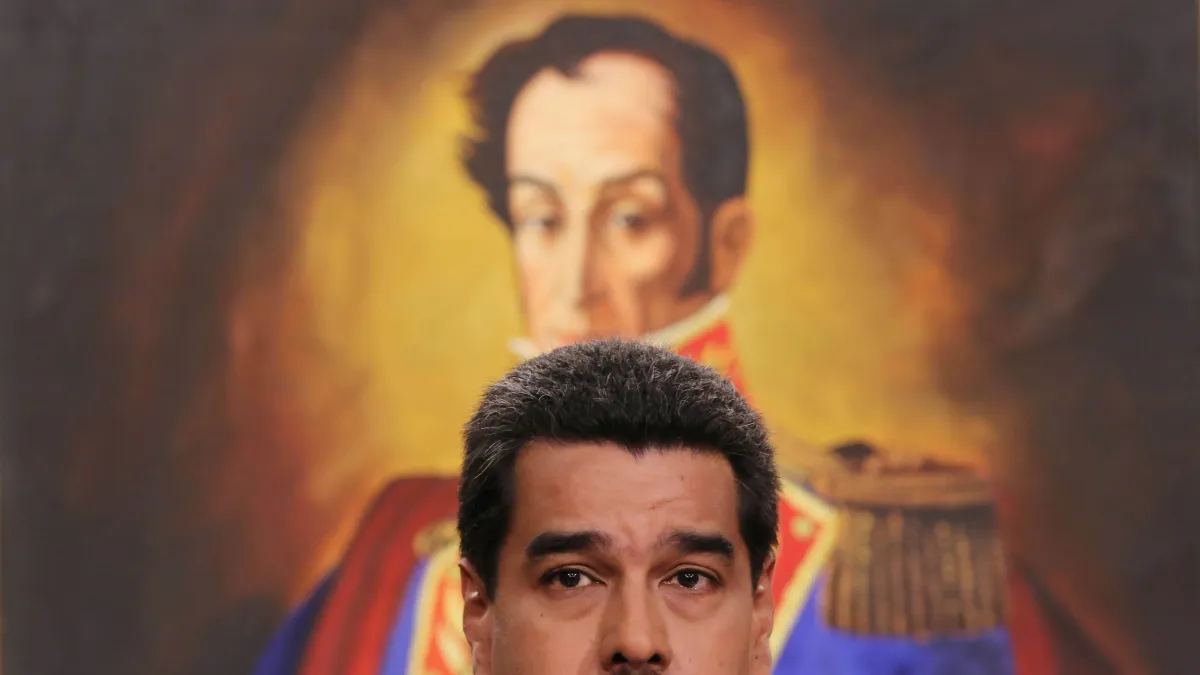 Venezuelan President Nicolás Maduro held a press conference at in 2014, in front of a backdrop of the Venezuelan leader of independence Simón Bolívar. (AP)
