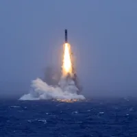 At noon on July 6, China's PLA Navy successfully launched a submarine-launched strategic missile carrying a training dummy warhead from a nuclear-powered submarine into international waters of the Pacific. Pictured: the moment the missile breaks the surfa At noon on July 6, China's PLA Navy successfully launched a submarine-launched strategic missile carrying a training dummy warhead from a nuclear-powered submarine into international waters of the Pacific. Pictured: the moment the missile breaks the surfa