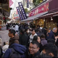 Shoppers crowd Tokyo's Ameyoko market street on December 31, 2024. From November 1, foreign visitors must pay Japan's consumption tax at the register and claim it back after customs confirms the goods are leaving the country. (AP) Shoppers crowd Tokyo's Ameyoko market street on December 31, 2024. From November 1, foreign visitors must pay Japan's consumption tax at the register and claim it back after customs confirms the goods are leaving the country. (AP)