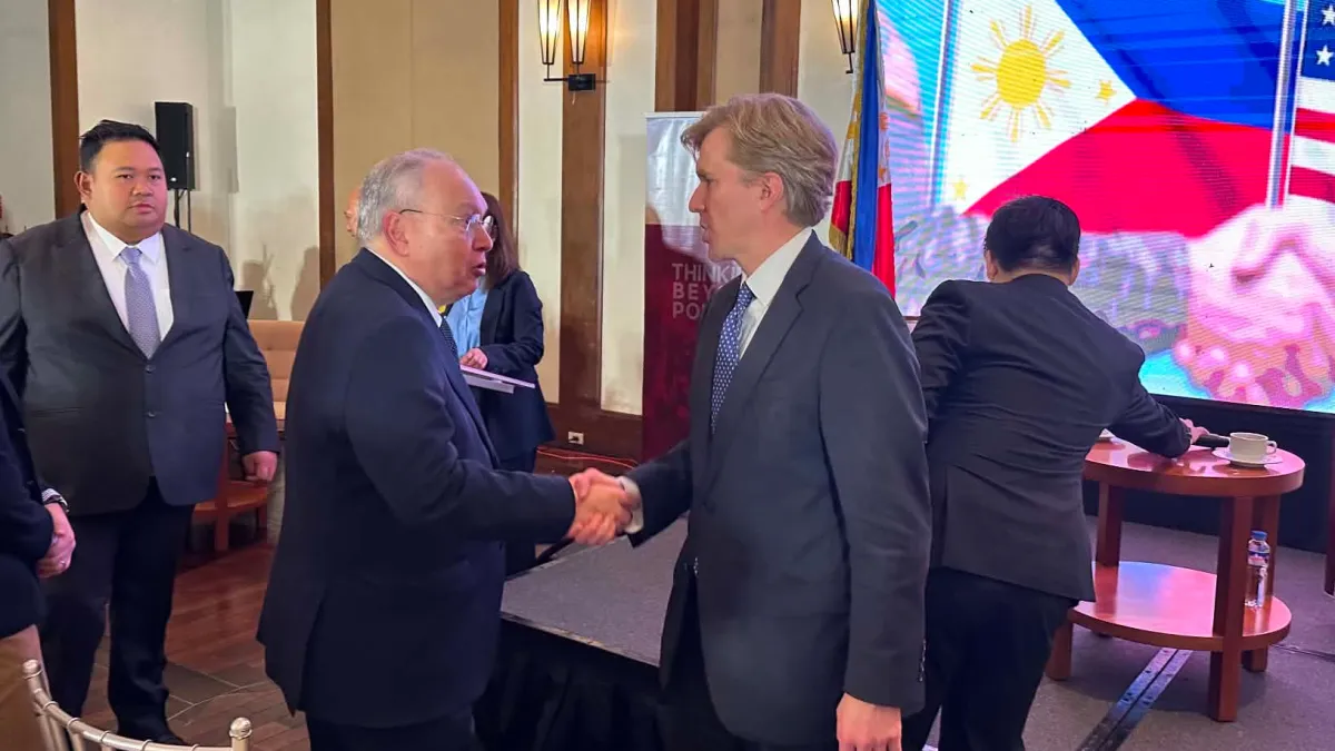 United States Undersecretary of Defense for Policy Elbridge Colby, right, shakes hands with Philippine Ambassador to the U.S., Jose Manuel Romualdez during a forum in Manila, Philippines on Monday, Aug. 10, 2026. (AP)