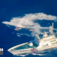 A Chinese coast guard ship fires water cannon at a Philippine resupply vessel near Second Thomas Shoal, South China Sea, March 23, 2024. (Armed Forces of the Philippines via AP, File) A Chinese coast guard ship fires water cannon at a Philippine resupply vessel near Second Thomas Shoal, South China Sea, March 23, 2024. (Armed Forces of the Philippines via AP, File)