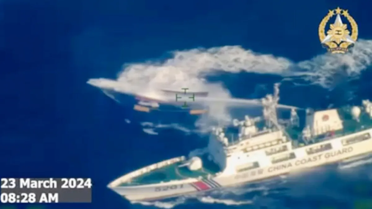 A Chinese coast guard ship fires water cannon at a Philippine resupply vessel near Second Thomas Shoal, South China Sea, March 23, 2024. (Armed Forces of the Philippines via AP, File)