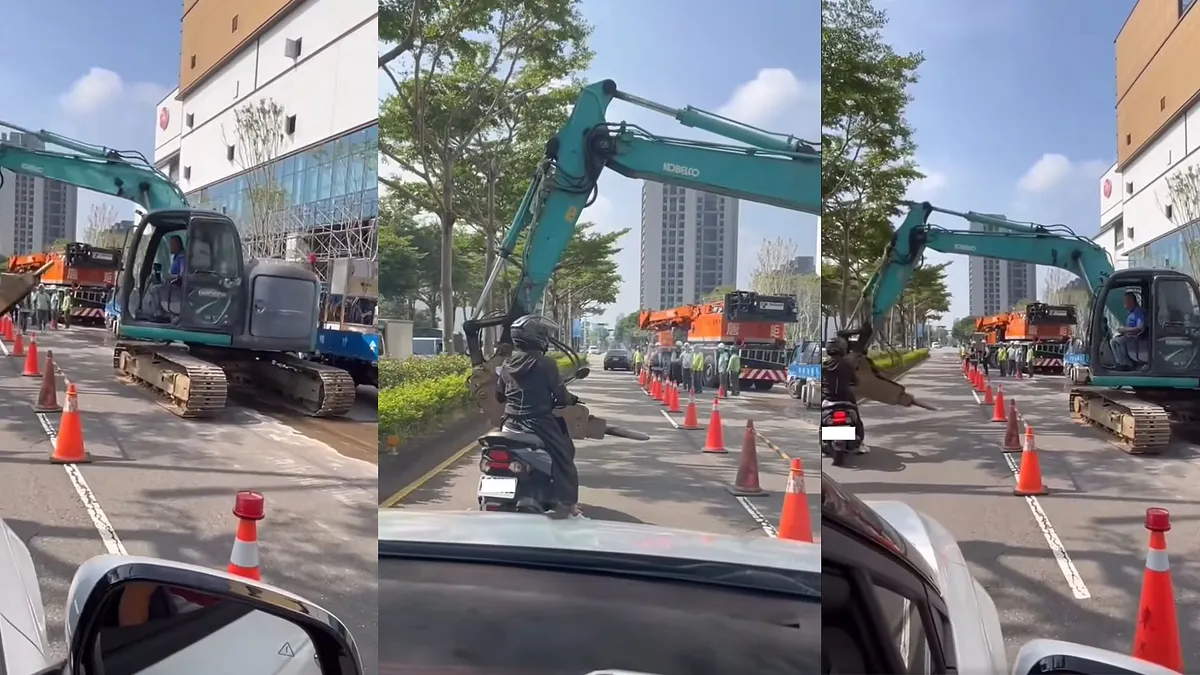 台中市北屯區崇德路4日上午9時許,一名騎士疑似因踢倒工地三角錐而惹怒工人,工人一怒之下竟駕駛怪手擋住騎士去路。(圖/爆料公社) 台中市北屯區崇德路4日上午9時許,一名騎士疑似因踢倒工地三角錐而惹怒工人,工人一怒之下竟駕駛怪手擋住騎士去路。(圖/爆料公社)