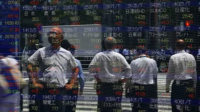 希臘違約在即引發市場的憂心,釀成全球股災,各國股市幾乎全部下跌。(美聯社)