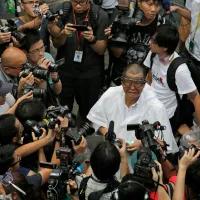 Hong Kong media mogul Jimmy Lai wears protective goggles as he protests outside government headquarters on September 28, 2014. (Associated Press) Hong Kong media mogul Jimmy Lai wears protective goggles as he protests outside government headquarters on September 28, 2014. (Associated Press)