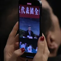 On March 7, 2024, journalists photograph Xinjiang Uyghur Autonomous Region Party Secretary Ma Xingrui as he delivers a work report. (AP) On March 7, 2024, journalists photograph Xinjiang Uyghur Autonomous Region Party Secretary Ma Xingrui as he delivers a work report. (AP)