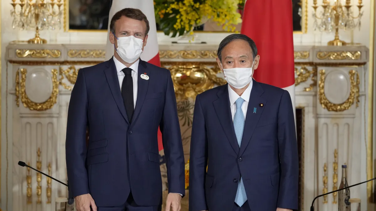2021年7月24日,日本首相菅義偉和法國總統馬克宏會談(AP)