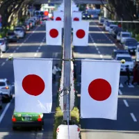 Japan's national flag lines a Tokyo street. (AP) Japan's national flag lines a Tokyo street. (AP)