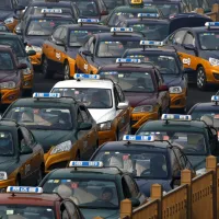 Taxis queuing outside Beijing Railway Station. (AP) Taxis queuing outside Beijing Railway Station. (AP)