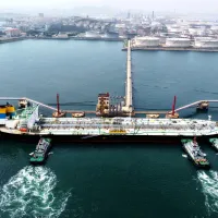 China has deployed its blocking statute in response to U.S. sanctions on Chinese petrochemical firms. Pictured: a tanker offloading cargo at a Shandong port. (File photo, AP) China has deployed its blocking statute in response to U.S. sanctions on Chinese petrochemical firms. Pictured: a tanker offloading cargo at a Shandong port. (File photo, AP)