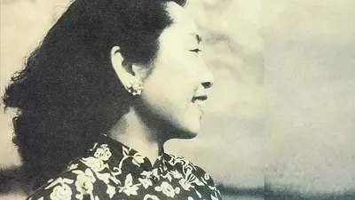 女畫家梁白波。