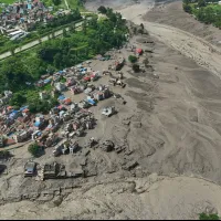 Damaged houses stand precariously near the swollen, debris-choked banks of the Trishuli River after flash floods in Nepal's Nuwakot district on Wednesday, Aug. 26, 2026.(AP) Damaged houses stand precariously near the swollen, debris-choked banks of the Trishuli River after flash floods in Nepal's Nuwakot district on Wednesday, Aug. 26, 2026.(AP)