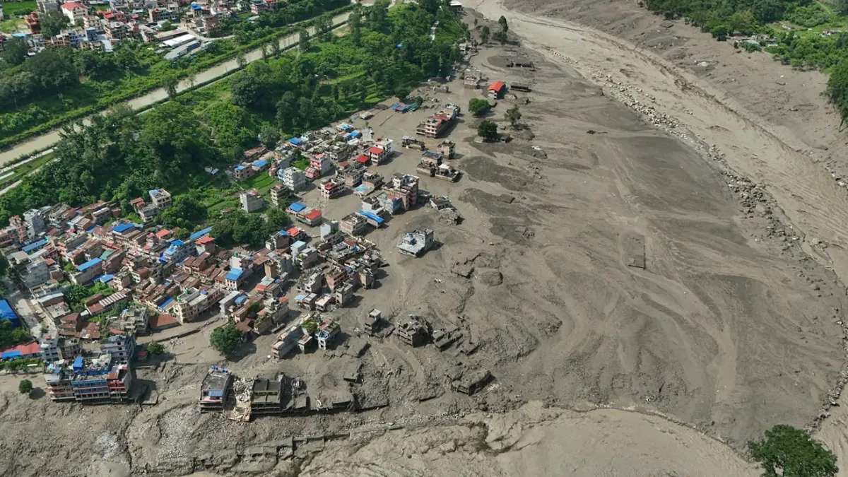 Damaged houses stand precariously near the swollen, debris-choked banks of the Trishuli River after flash floods in Nepal's Nuwakot district on Wednesday, Aug. 26, 2026.(AP)