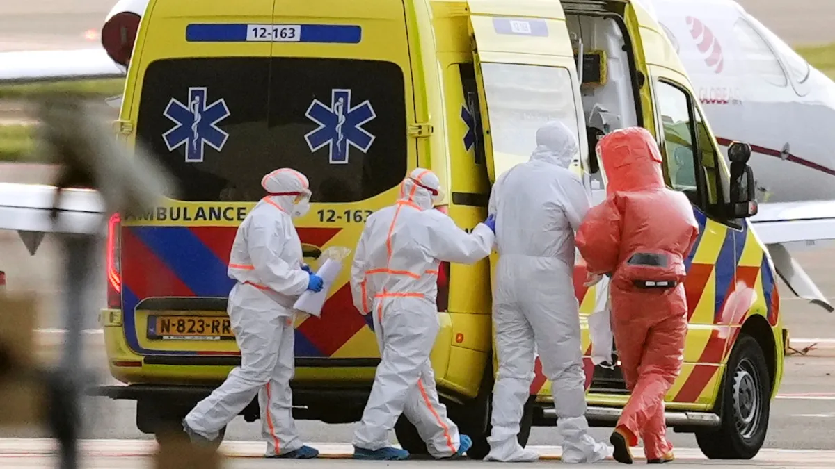On May 6, 2026, at Amsterdam Schiphol Airport in the Netherlands, medical personnel assist a patient suspected of being infected with hantavirus. The patient had previously been evacuated from the MV Hondius oil tanker. (AP)
