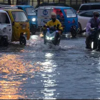 Riders navigate flooded streets in Beijing on July 10, 2026, after heavy rainfall inundated parts of the capital. (AP) Riders navigate flooded streets in Beijing on July 10, 2026, after heavy rainfall inundated parts of the capital. (AP)