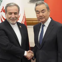 Iranian Foreign Minister Abbas Araghchi (left) met with Chinese Foreign Minister Wang Yi (right) in Beijing on May 6. (Xinhua) Iranian Foreign Minister Abbas Araghchi (left) met with Chinese Foreign Minister Wang Yi (right) in Beijing on May 6. (Xinhua)