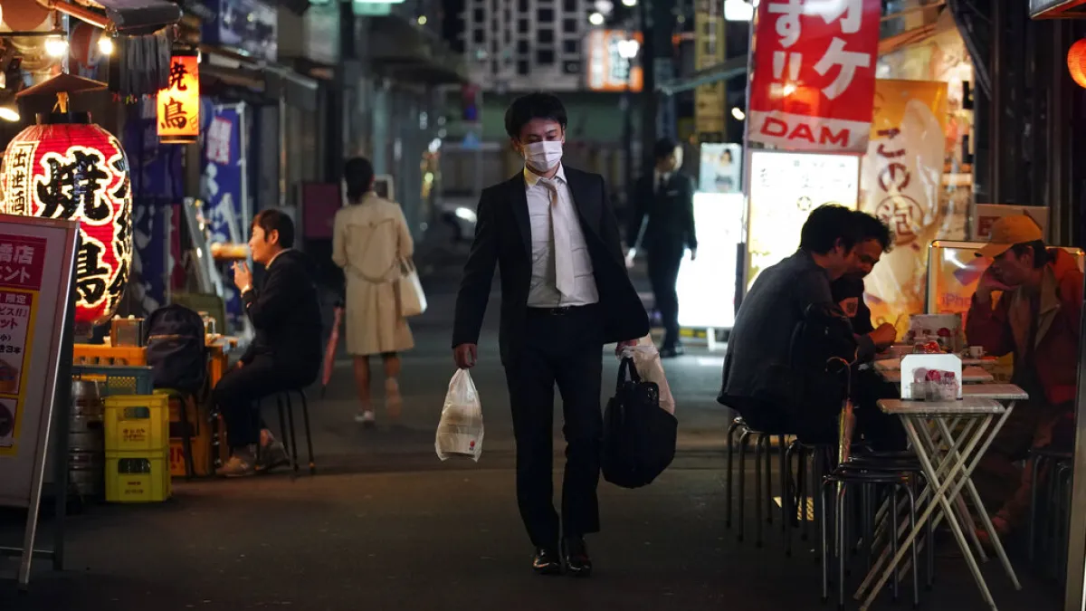 日本上班族、日本爸爸、日本社畜。(美聯社)