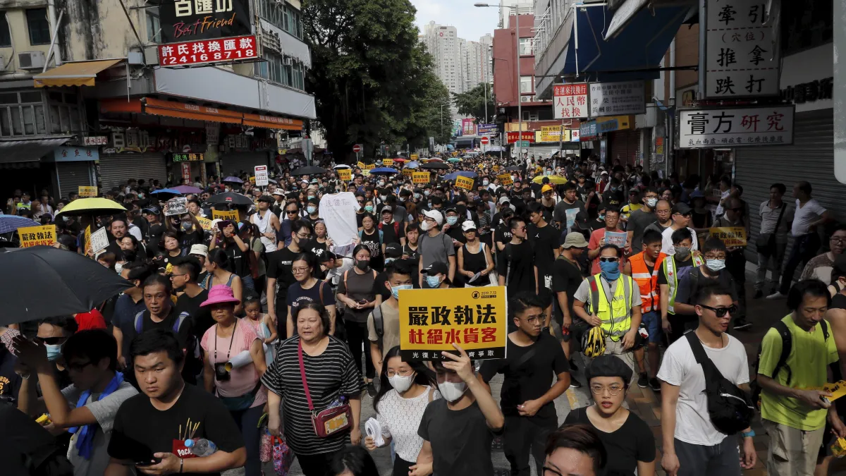 2019年7月13日,香港市民發動「光復上水」遊行,要求港府解決中國「水貨客」到香港購物「掃貨」造成的亂象。(AP)