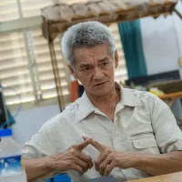 明利村の林万成村長は、昨年のせき止め湖越流前の行政組織の対応の鈍さを振り返ると、今も語気を強める。(劉偉宏撮影) 明利村の林万成村長は、昨年のせき止め湖越流前の行政組織の対応の鈍さを振り返ると、今も語気を強める。(劉偉宏撮影)
