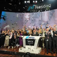 SpaceX employees celebrate during the bell-ringing ceremony for the company's initial public offering (IPO) at the Nasdaq Exchange in New York on June 12, 2026. (AP) SpaceX employees celebrate during the bell-ringing ceremony for the company's initial public offering (IPO) at the Nasdaq Exchange in New York on June 12, 2026. (AP)