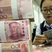 全球越來越多旨在規避制裁的非法活動,正以人民幣進行結算。(資料照:AP) 全球越來越多旨在規避制裁的非法活動,正以人民幣進行結算。(資料照:AP)
