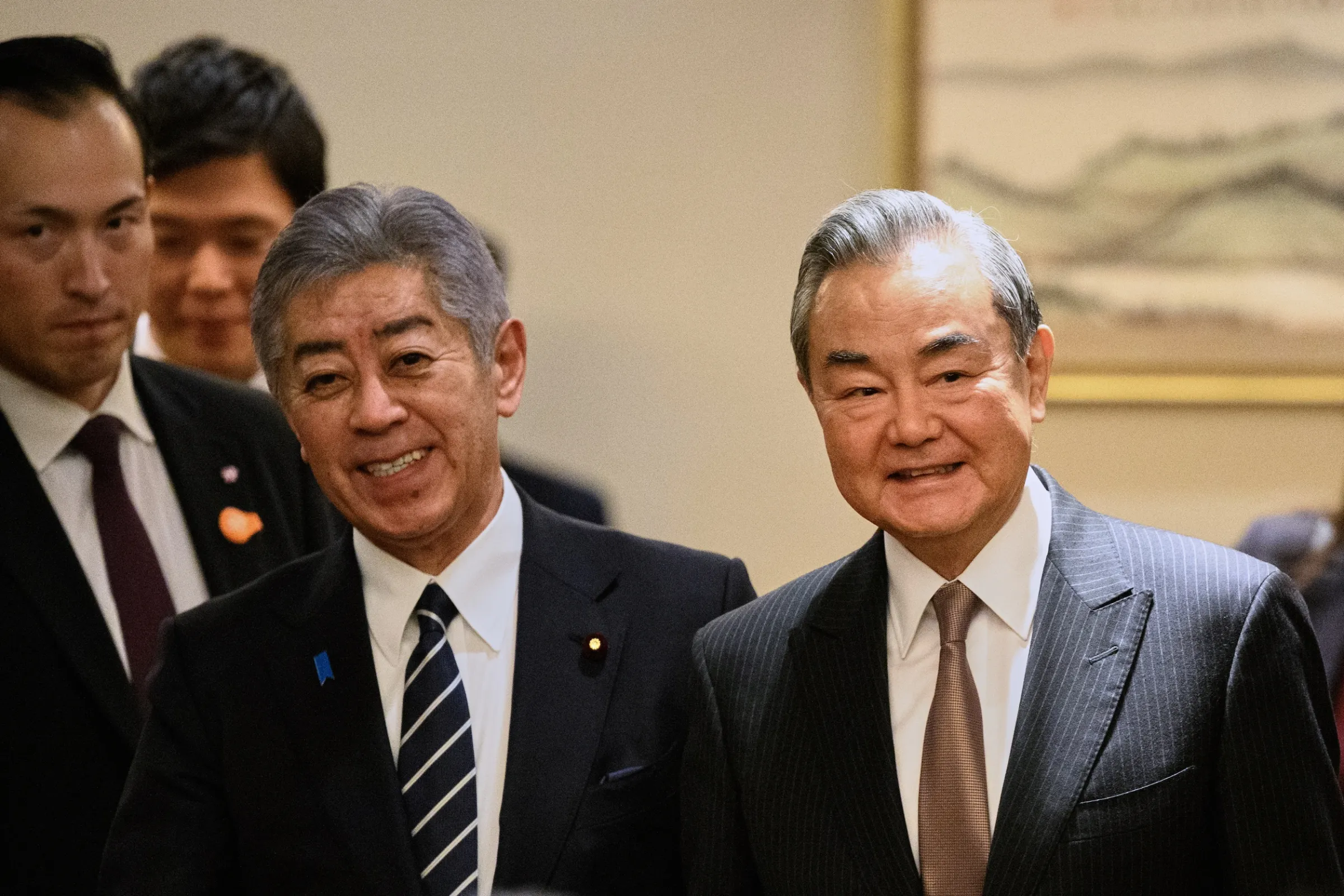 Takeshi Iwaya, then Japan's foreign minister, meets Chinese Foreign Minister Wang Yi in Tokyo, March 22, 2025. (AP)