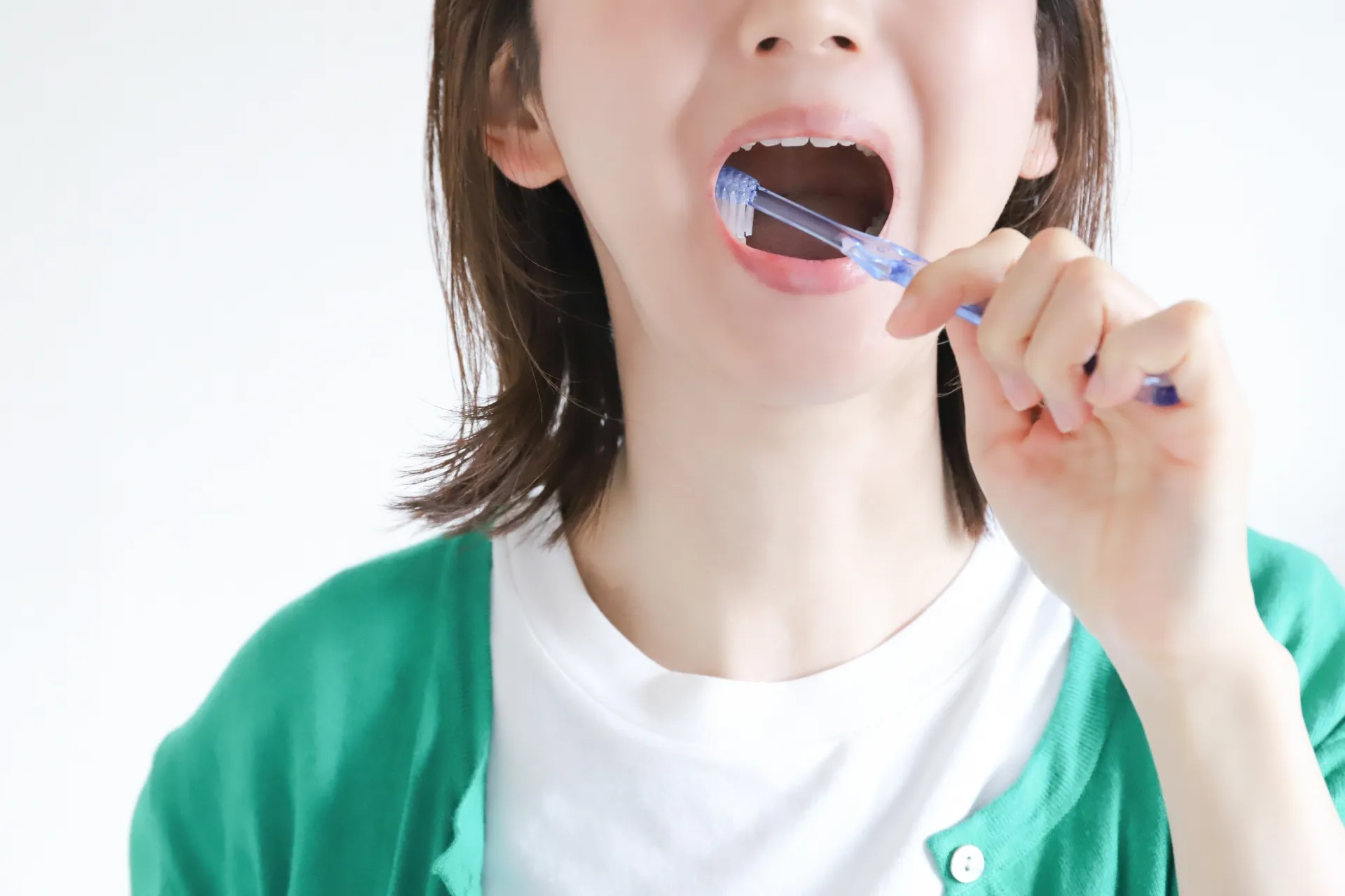 Brushing alone leaves the deepest gaps between teeth untouched, and it is there that plaque hardens into tartar.