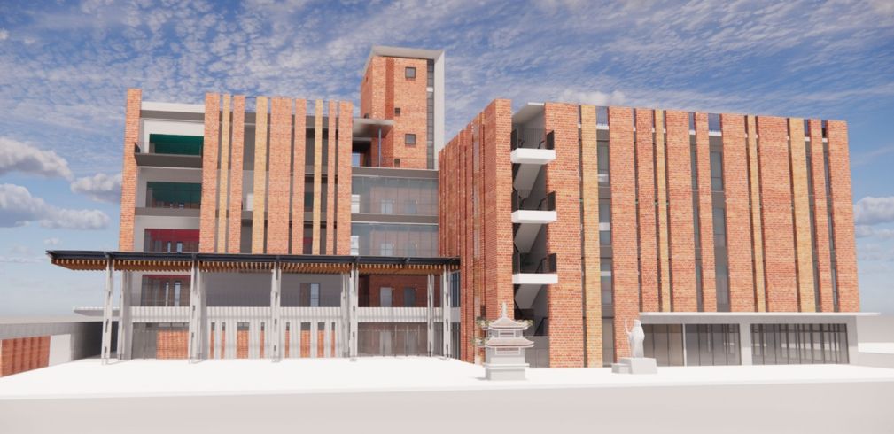 園區外觀以紅磚堆砌，內部設有採光井，使空間明亮柔和。圖/新北市政府工務局