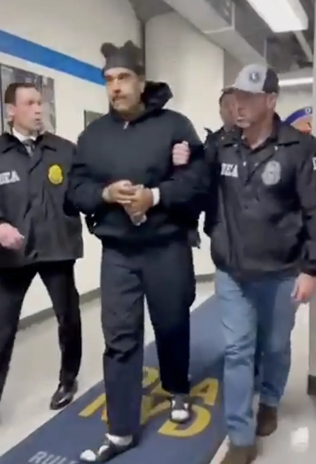 Footage of Maduro being transferred to custody released by the U.S. government. (Sourced from X)
