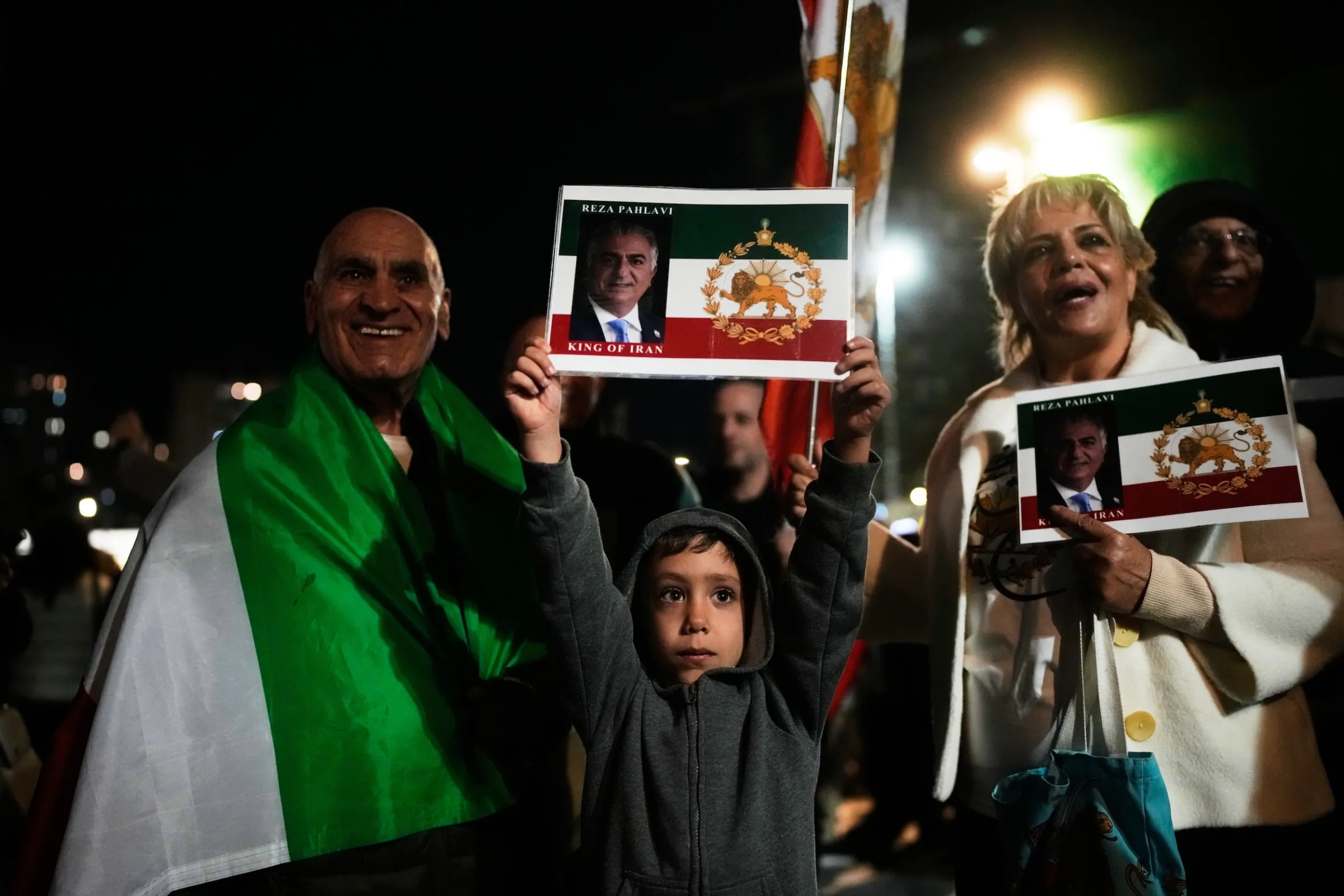 On January 14, 2026, demonstrators in Israel wave the pre-revolutionary Iranian flag and hold portraits of the exiled Crown Prince Pahlavi. (Associated Press)