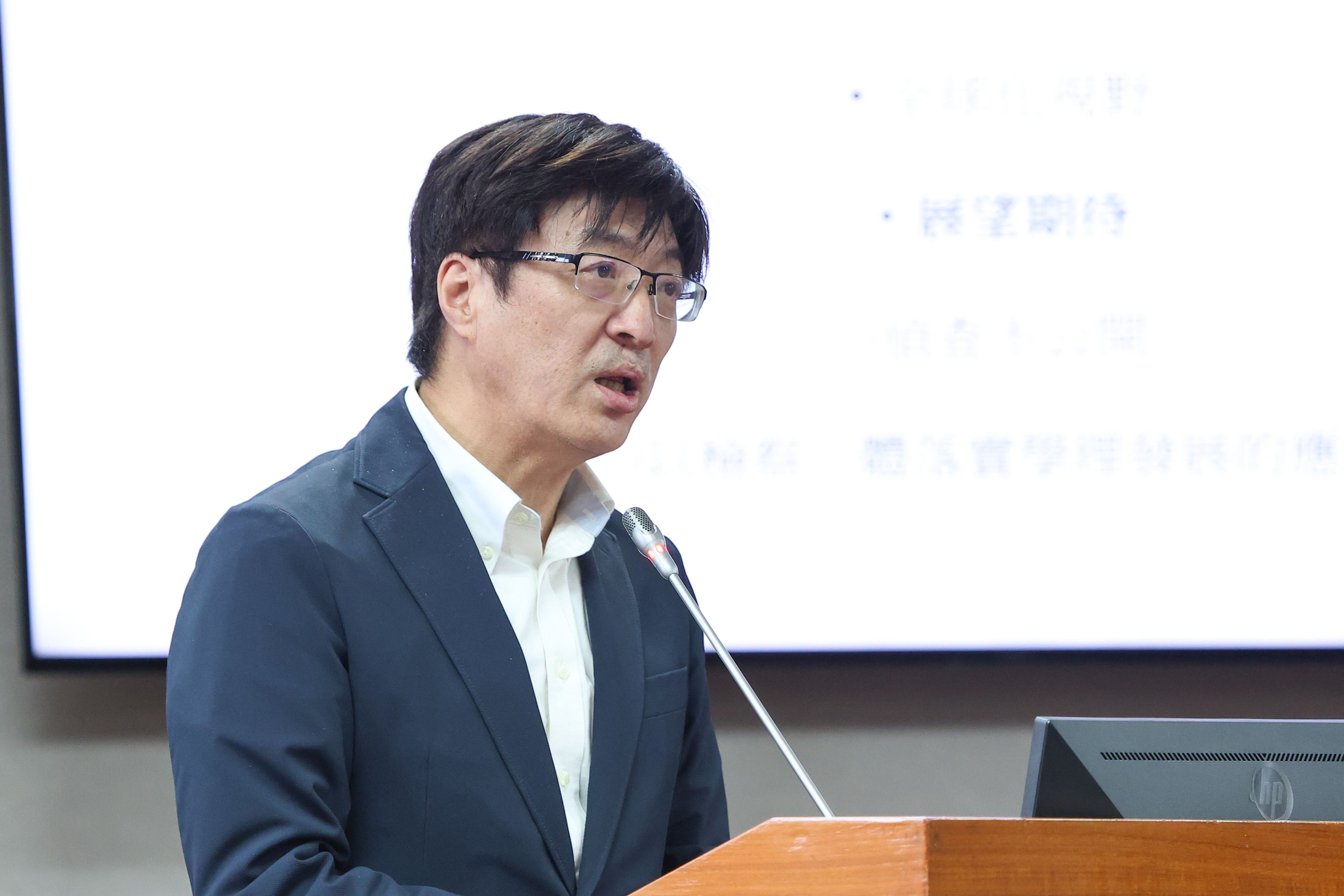 20260408-政治大學法學院副教授李聖傑8日出席司法法制委員會公聽會。（顏麟宇攝）