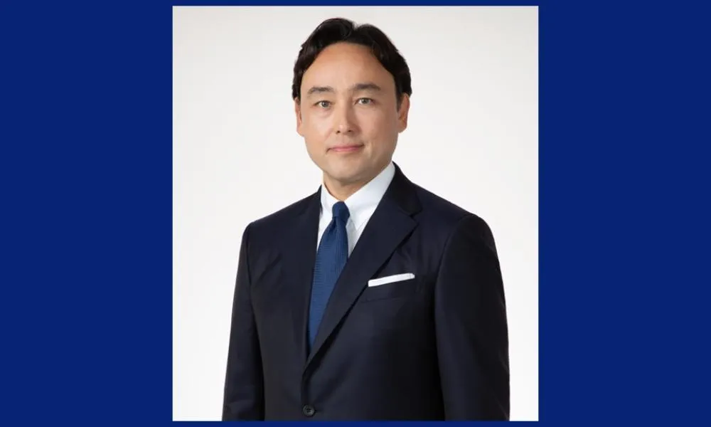 日本自動車輸入組合のゲルティンガー剛理事長は講演で、輸入車業界がEVモデルの拡充を進める一方、円安とインフラ整備の遅れが今後の課題であると指摘した。FCCJ