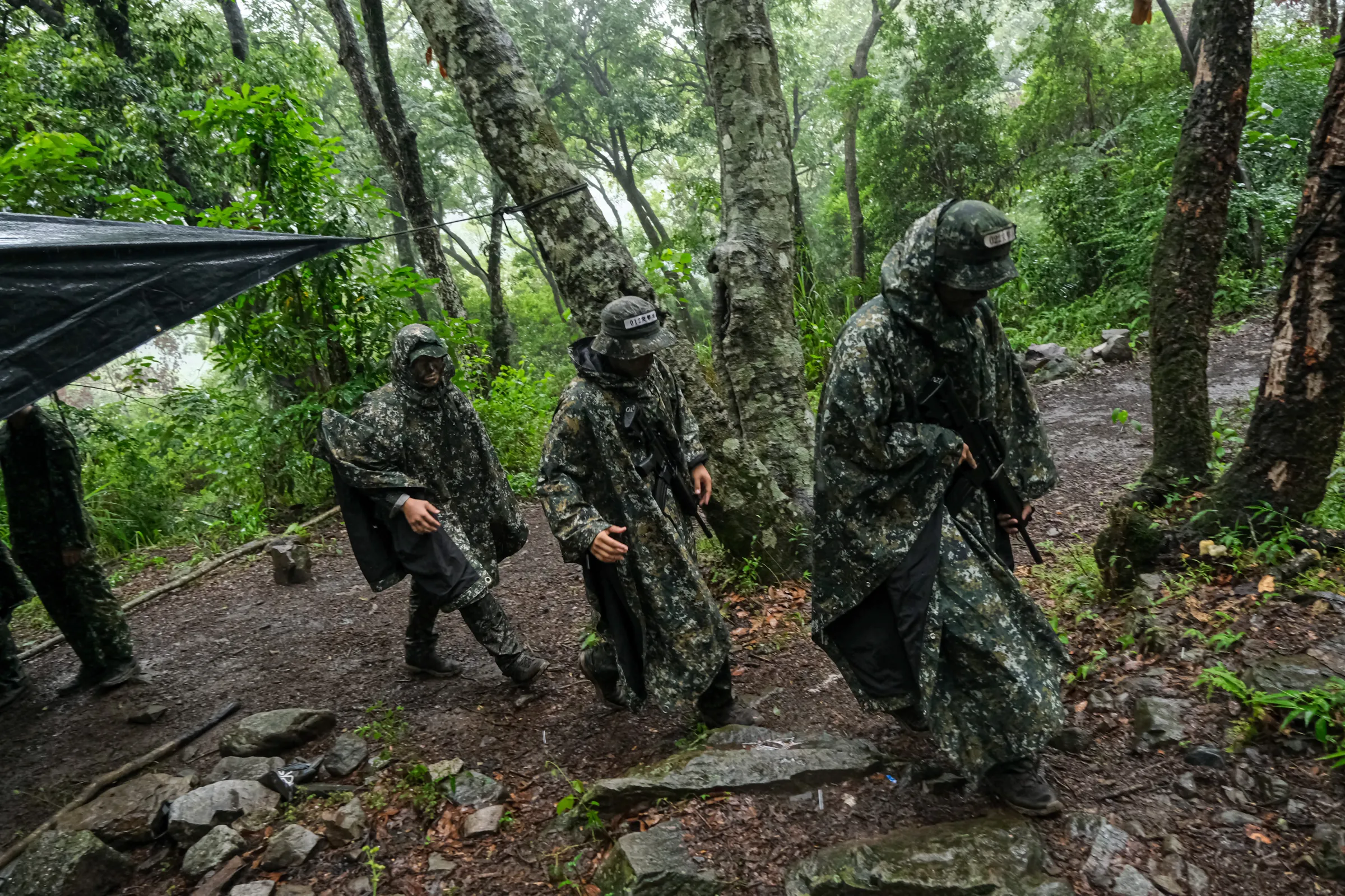 Trainees set up concealment positions and conduct sand table exercises at Liyang Garrison on June 9, 2026.
