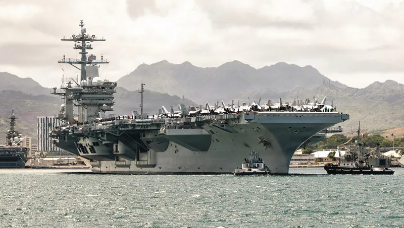 USS Theodore Roosevelt (CVN 71) departs Pearl Harbor during the 2026 RIMPAC exercise sea phase.