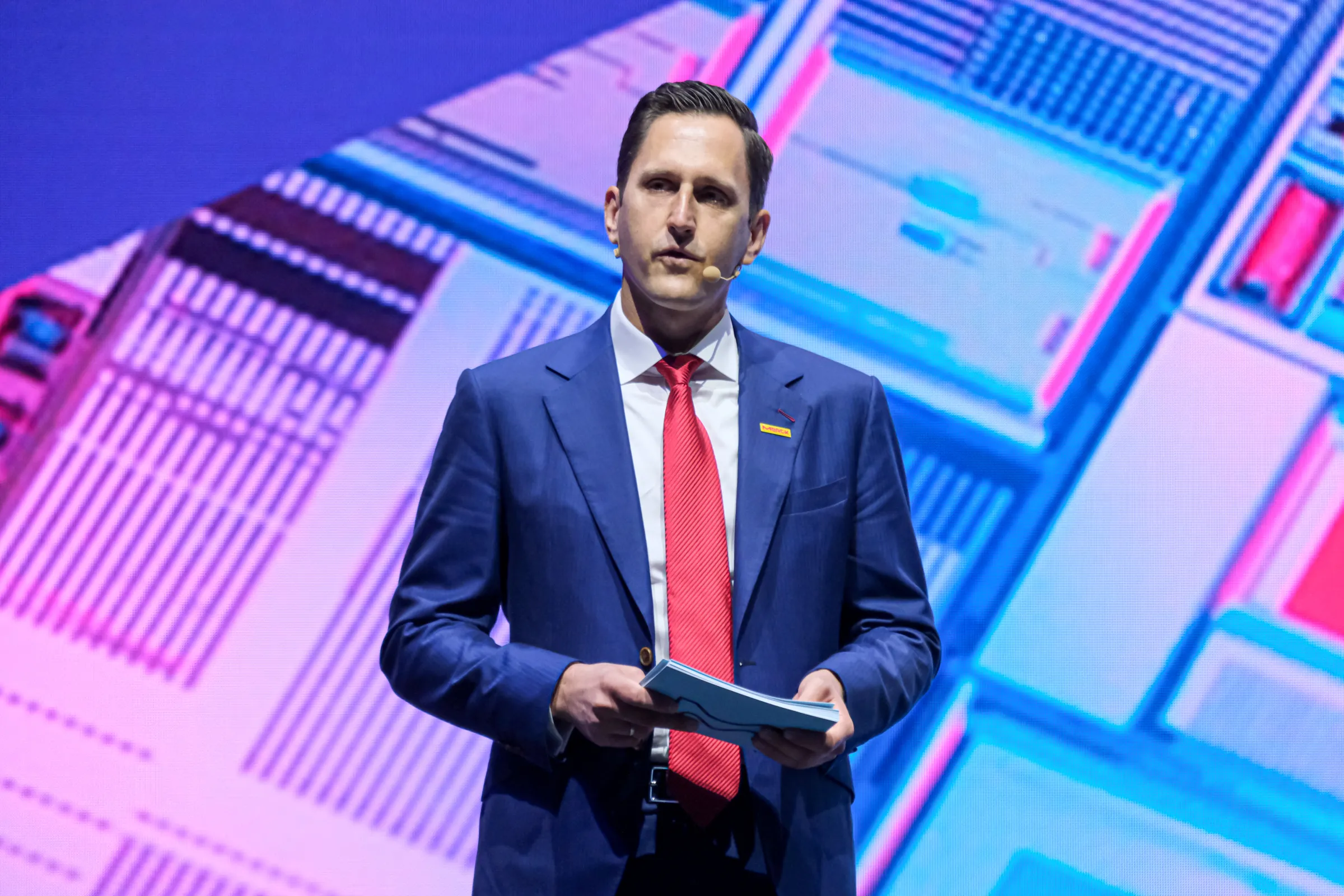 Benjamin Hein, a member of Merck's executive board and chief executive of its electronics business, speaks at the SEMICON Taiwan Masters Forum and Global Ecosystem Summit at the Nangang Exhibition Center on September 2. (Photo by Liu Wei-hung)