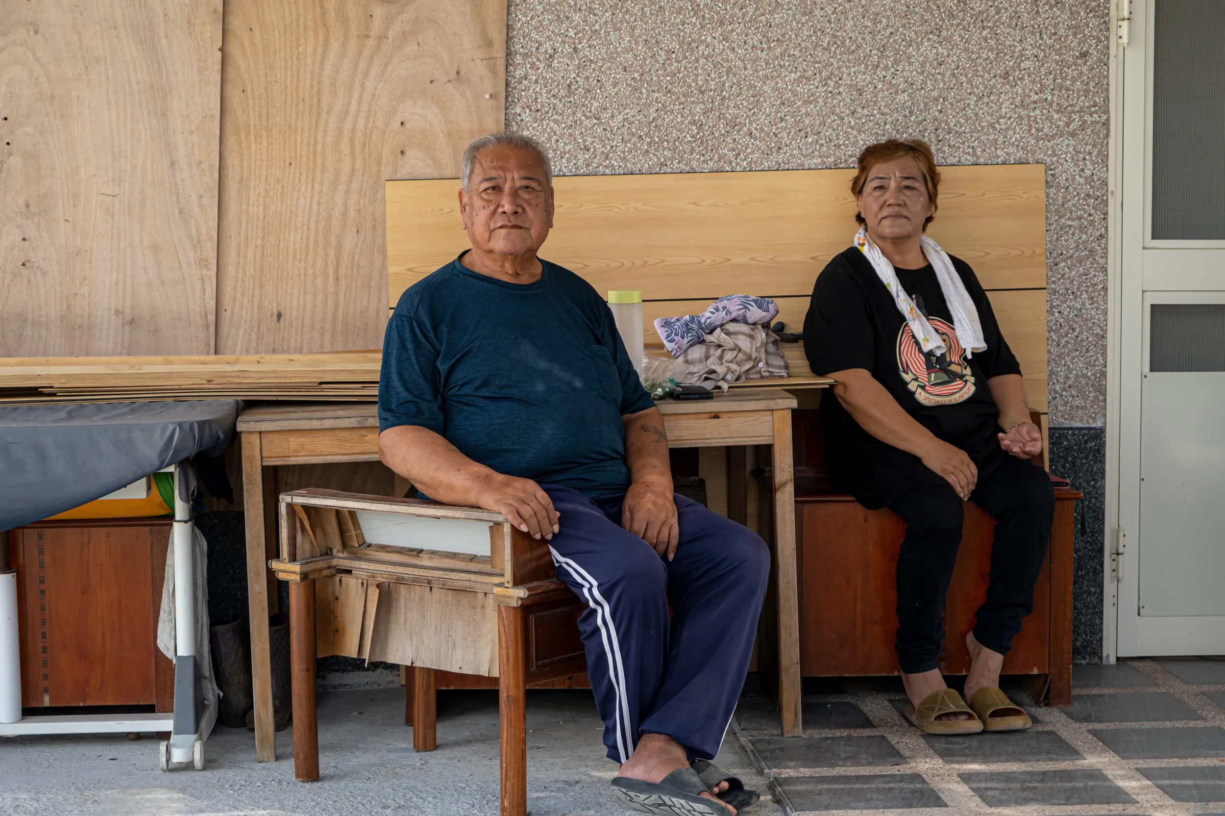 Chen Chun-lung, left, and his wife Ba A-mei, who lost their house at Atomo in the flood.