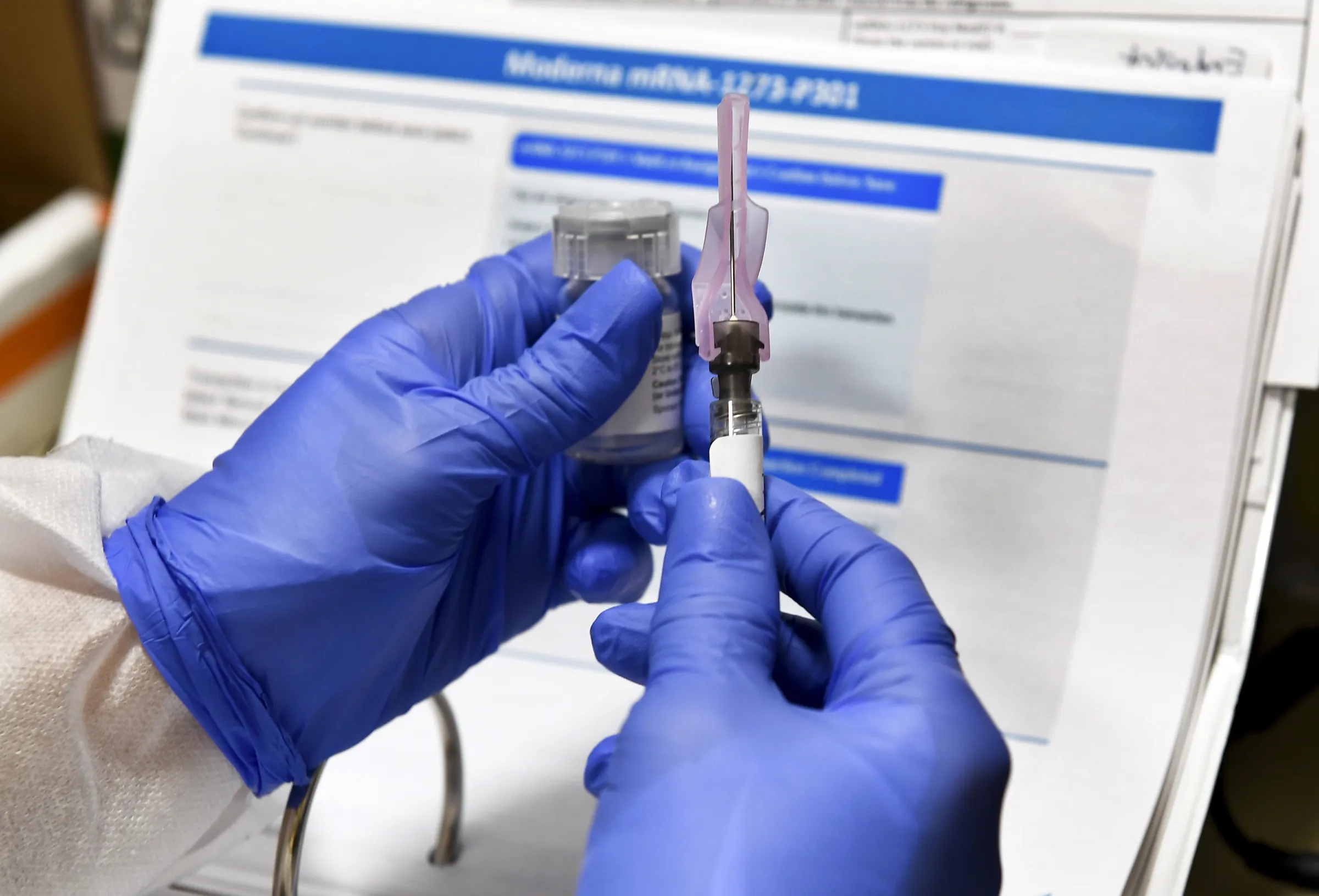 Moderna's original mRNA-1273 COVID-19 vaccine, seen here in a 2020 file photo, was built on the same messenger RNA platform now being adapted into a personalized cancer treatment. (AP)