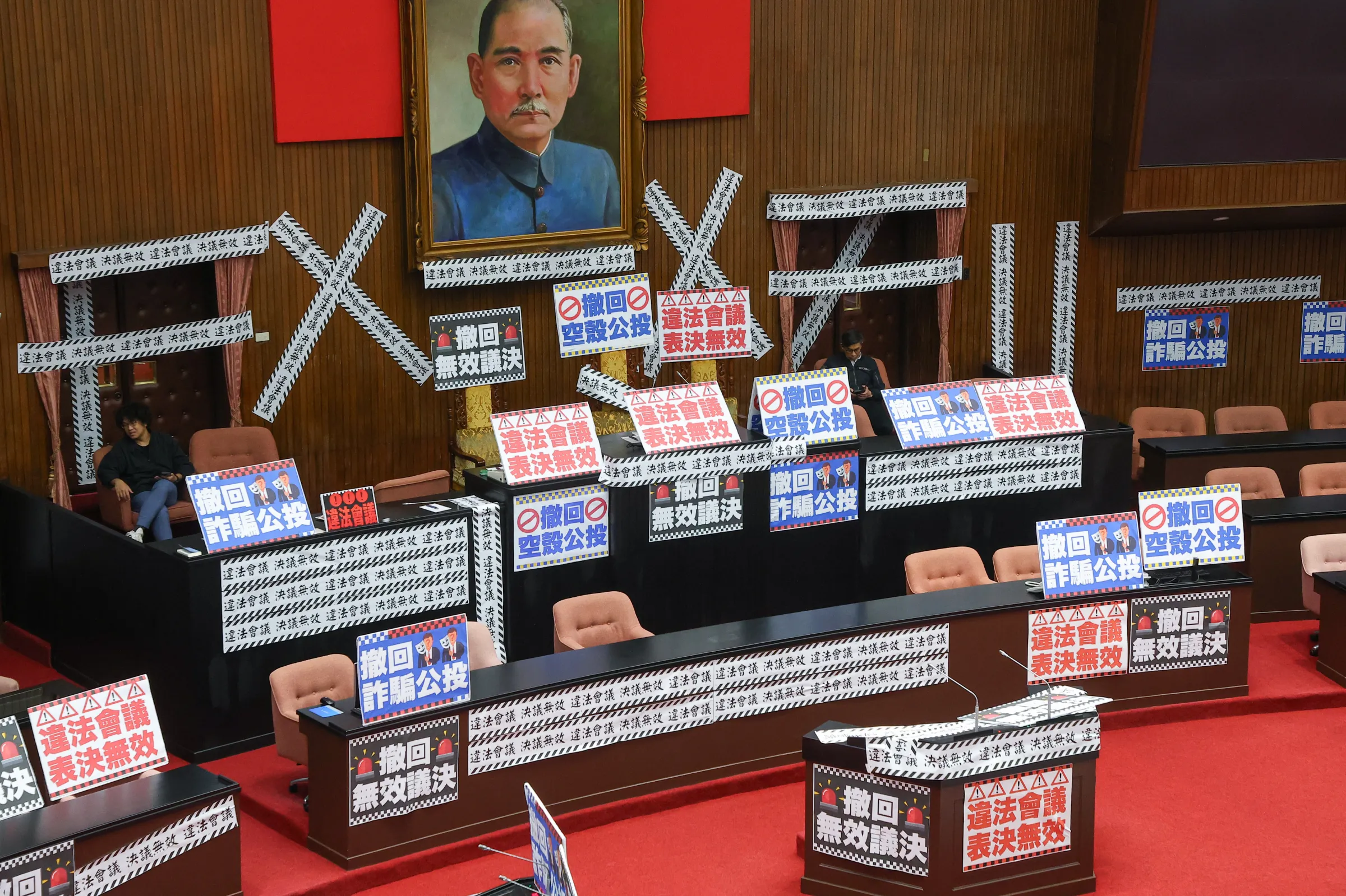 DPP legislators occupied the speaker's podium in the legislative chamber early on March 28.