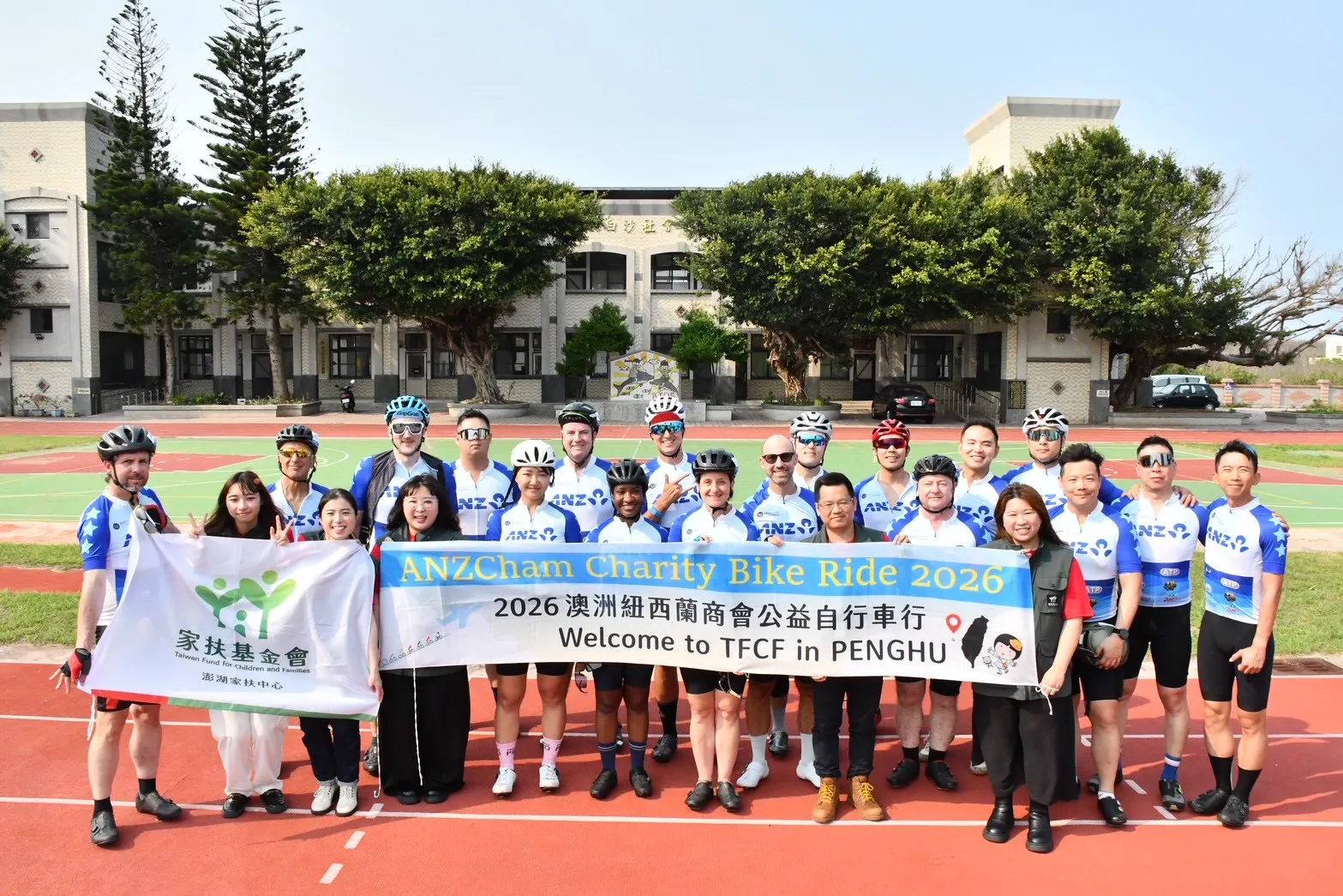 ANZCham riders and TFCF Penghu Centre staff gather for a group photo at the Baisha service station in Penghu on April 14, 2026.