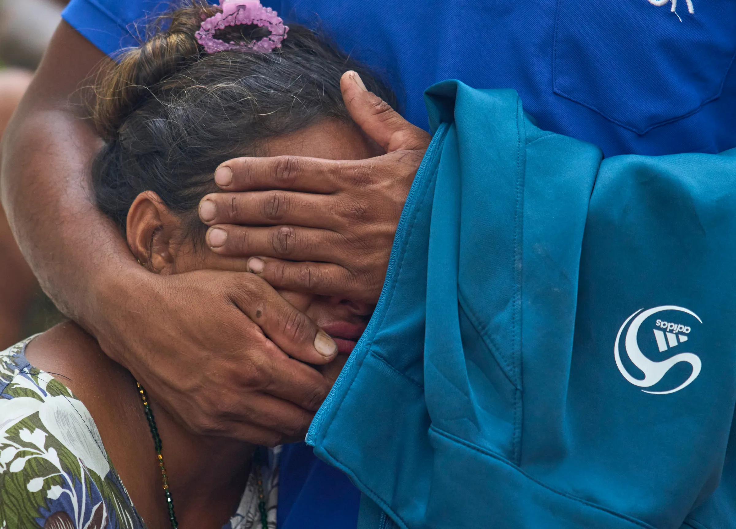 A woman consoles a relative as they wait for news of family members missing after flash flooding along the Trishuli River in Nepal's Nuwakot district, Wednesday, Aug. 26, 2026.(AP)